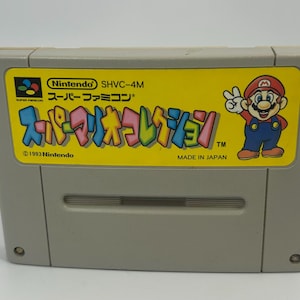 May include: A Super Mario Collection video game cartridge for the Super Famicom. The yellow label features the game title in Japanese, a Mario illustration, and the Nintendo logo. Made in Japan.