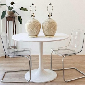 Two large art deco post modern cream glass table lamps in the Haegar style with curved draped line shell ribbed pattern