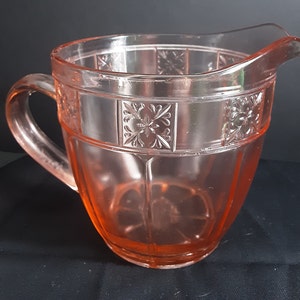 Pink Jeanette Glass Company water pitcher in the Doric pattern