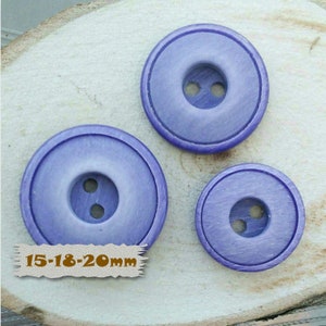 May include: Three purple wooden buttons with two holes each. The buttons are 15-18-20mm in size.