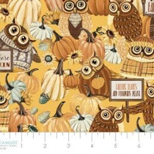 May include: A yellow fabric with a repeating pattern of owls, pumpkins, and sunflowers. The owls are wearing sweaters and scarves. The text "Where there's a will there's a way" and "Autumn leaves and pumpkins please" are printed on signs in the pattern.