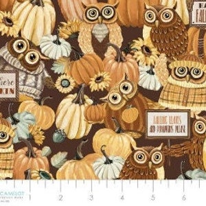 May include: A brown fabric with a repeating pattern of owls and pumpkins. The owls are wearing sweaters and the pumpkins are in various shades of orange and yellow. The fabric has a rustic, autumnal feel.