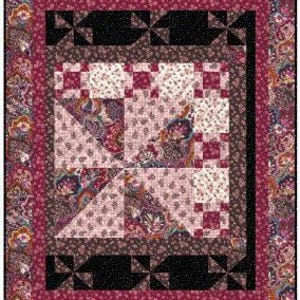 May include: A quilt block featuring a pink, brown and black colour scheme. The block is made up of smaller squares and triangles, and features a paisley pattern.