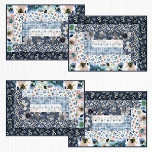May include: Four blue and white floral patterned fabric placemats with a layered design. The placemats have a subtle distressed look and are perfect for adding a touch of elegance to any table setting.