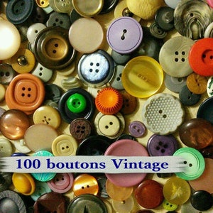 May include: A collection of vintage buttons in various colors, shapes, and sizes. The buttons are made of plastic, metal, and fabric. The buttons are arranged in a random pattern. The text "100 boutons Vintage" is visible in the image.