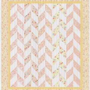 May include: A quilt with a chevron pattern in shades of pink, white, and yellow. The quilt has a floral border.