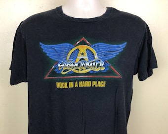 Camiseta Vtg 1982 Aerosmith Concerto Preta G/GG Estrelas da Tela dos Anos 80 Banda de Rock Clássico Rock In A Hard Place