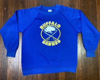 Sudadera vintage de los 80 de los Buffalo Sabres, estilo gabardina, cuello redondo raglán, fabricada en EE. UU., talla juvenil grande (14-16).