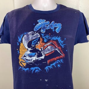 Vtg 1979 The Tubes Konzert T-Shirt Blau 70er Jahre Classic Rock Band Fernbedienung Single Stitch In abgenutzter Zustand