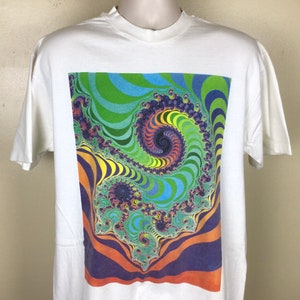 May include: White t-shirt featuring a colourful psychedelic spiral design printed on the front.