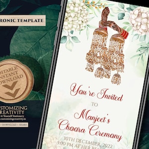 May include: An electronic invitation template on a smartphone screen. The design features floral elements, gold jewelry, and text that reads "You're Invited to Manjeet's Choora Ceremony" with the date and time. The top of the screen says "ELECTRONIC TEMPLATE".
