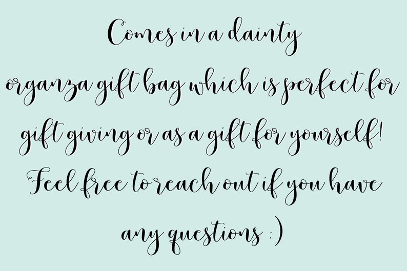 May include: Text in a cursive font reads: "Comes in a dainty organza gift bag which is perfect for gift giving or as a gift for yourself! Feel free to reach out if you have any questions :)"