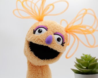 Berta, a muppet who loves springs and everything that is orange - hand puppet