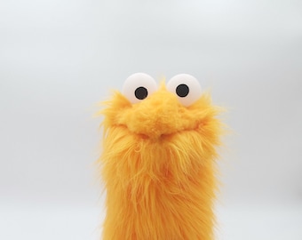 Little Gustav, an orange muppet who likes birds, sandwiches with cheese, toamto and mayo - muppet, hand puppet
