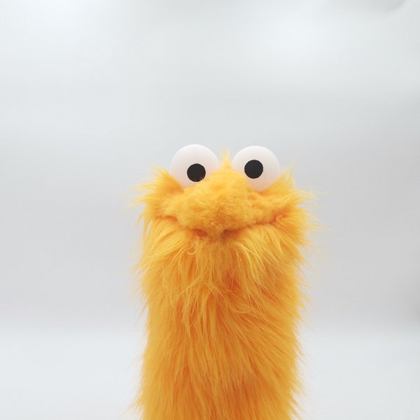 Little Gustav, an orange muppet who likes birds, sandwiches with cheese, tomato, and mayo - muppet, hand puppet