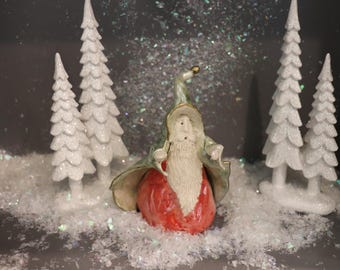 Miniature Porcelain Santa Figurine: Hand-Sculpted Collectible