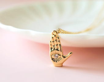 Gold Hamsa Hand Necklace: Cubic Zirconia Charm