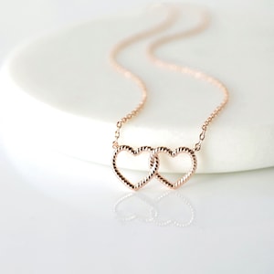 Rose Gold Linked Hearts Necklace: Twisted Dual Heart Charm