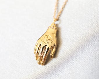 Gold Hamsa Hand Necklace: Cubic Zirconia Pendant