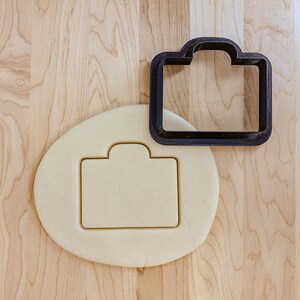 Porte-documents ou emporte-pièce pour appareil photo