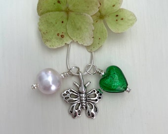Diana Ingram three charm necklace in Sterling Silver with cornflower blue Murano glass heart white pearl and snake chain dolphin
