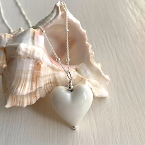 Diana Ingram necklace with white (cream) pastel Murano glass medium heart pendant on Sterling Silver satellite chain