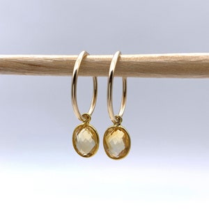 Diana Ingram earrings with citrine (gold, pale yellow) oval crystal gemstones on 22 Carat gold vermeil small hoop sleeper ear wires