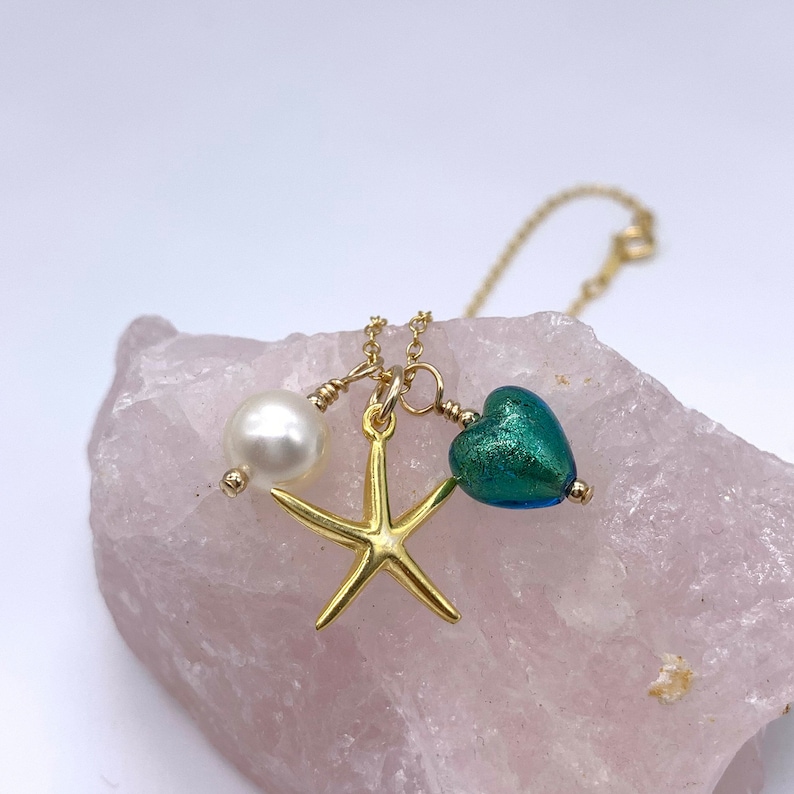 white pearl and chain jade, teal Murano glass heart Diana Ingram three charm necklace in 22 Carat gold vermeil with sea green starfish