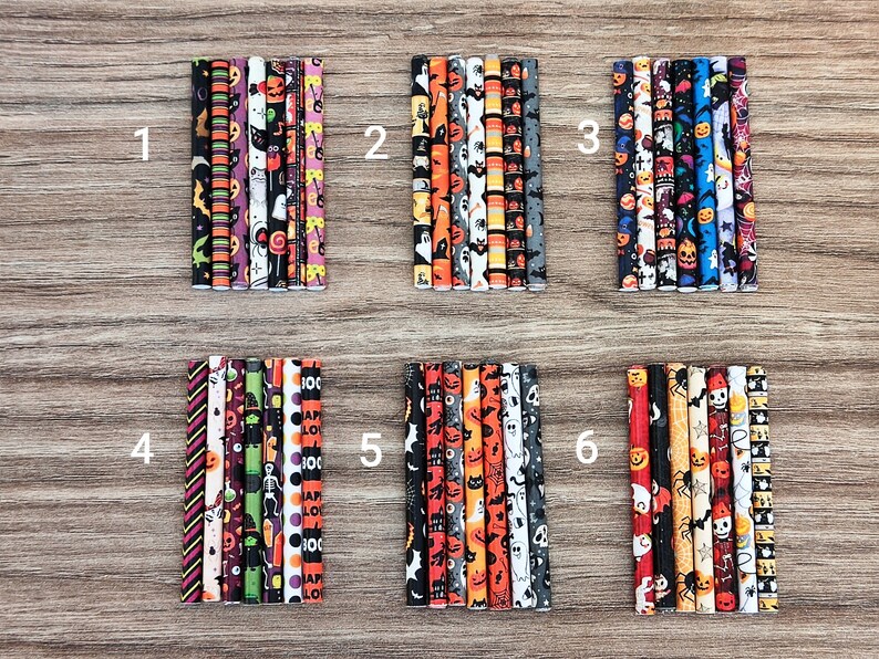 May include: Six sets of Halloween themed pencils, each set containing 10 pencils with different patterns. The patterns include pumpkins, bats, ghosts, candy corn, and other Halloween imagery. The pencils are arranged in rows of 10, numbered 1 through 6.