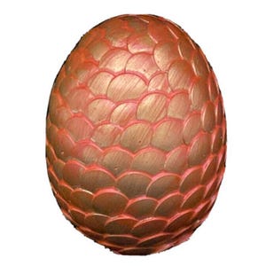 May include: A decorative, oval-shaped dragon egg with a textured, scaled surface. The egg features a metallic gold and red color scheme, with the scales outlined in red. The overall design is reminiscent of fantasy or mythical themes.