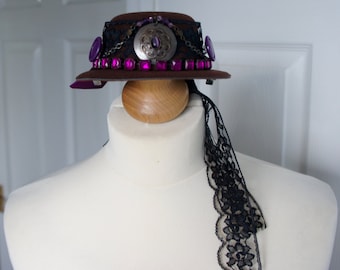 One Of A Kind Steampunk Purple Ornamented Brown Mini Riding Hat Fascinator With Black Lace Band And Train And Large Purple Bow Detail