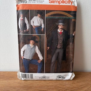 May include: A Simplicity sewing pattern envelope, number 2595, size BB 46, 48, 50, 52. The packaging features photographs of individuals wearing western-style vests, shirts, and coats, with a top hat and a red necktie. The text includes Simplicity.