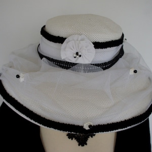 Upcycled Black And White Wide Brim Paper Hat With Black Braid And Ribbon Detail, White Net With Silk Roses And Bead Adornments