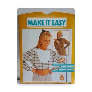 May include: A vintage sewing pattern titled "MAKE IT EASY" with a yellow and white design. The cover features a woman wearing a plaid top and a white bib. The number 6 is visible on the bottom right.