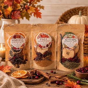 May include: Three kraft paper pouches containing dried fruit, spices, and herbs for simmering. Each pouch features a circular label with text reading Harvest Simmer Pot, Fall Simmer Pot, and Autumn Simmer Pot, decorated with seasonal botanical illustrations.
