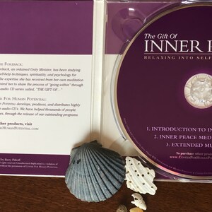 May include: A CD case with a purple interior and a CD labeled "The Gift of Inner Peace." The CD case includes information about Connie Foreback and Center for Human Potential. The CD features tracks for relaxation and self-empowerment.