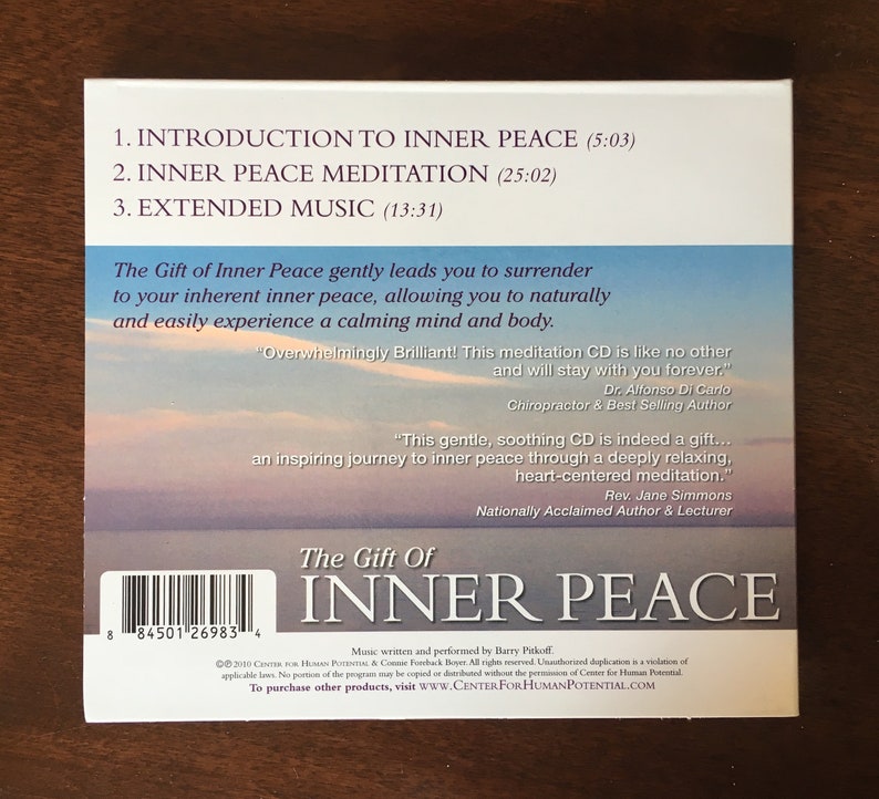 May include: A CD case with the title "The Gift of Inner Peace" in white text. The case features a serene sky and ocean background. Text includes track titles and quotes about the CD's benefits. The CD is designed to promote relaxation and inner peace.
