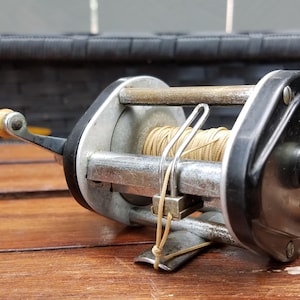 castomatic fishing reel AC Baitcasting Saltwater Freshwater Reels Max Drag 8KG Light Surf Cast Reel Baitcaster Reels (Left Hand) : Sports & Outdoors Japanese stainless steel bearings Outdoorsman Castomatic, Quaker City Gear