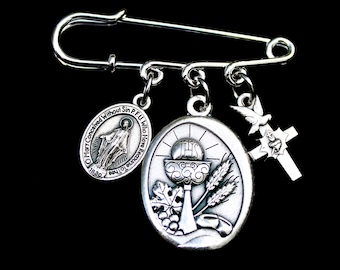 May include: Silver tone religious charm pin with a chalice, grapes, wheat, a dove, and a cross. The charm is inscribed with "O Mary Conceived Without Sin P.F.U. Who Have Recourse To You"