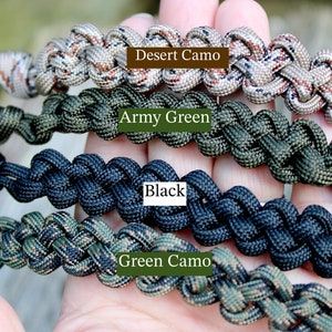 May include: Four paracord bracelets in different colors and patterns: desert camo, army green, black, and green camo.