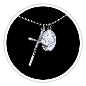 May include: A silver-toned metal necklace featuring a ball chain with two pendants: a crucifix cross with the figure of Jesus and an oval-shaped medal depicting Saint Augustine with the text St. Augustine inscribed along the edge of the charm.