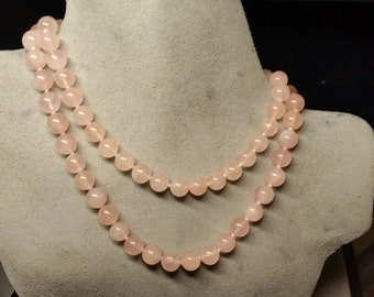 Vintage Rose Quartz Bead(10-10.5mm) Necklace 31" L secured by 14k yellow gold fly-leg clasp. Smooth Spherical beads Slight color variation.