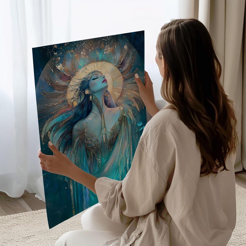 May include: A framed art print depicting a celestial woman with long blue hair, a golden halo, and flowing teal robes. The artwork has a dreamy, ethereal quality with gold accents and a dark blue background.