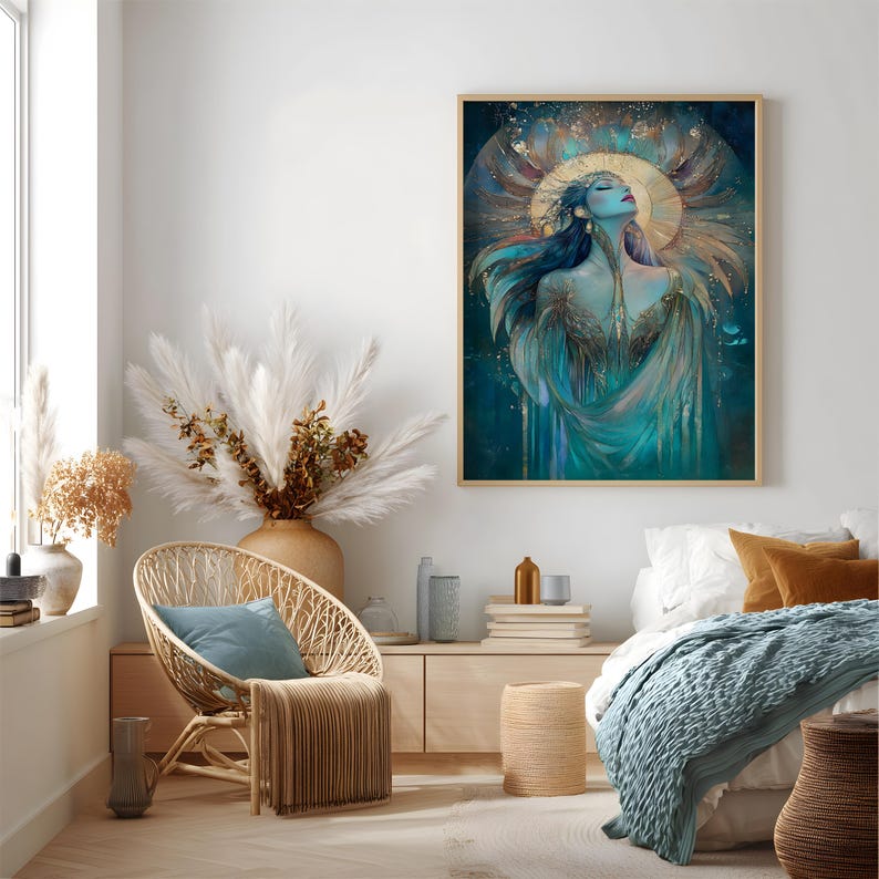 May include: A framed art print depicting a woman with flowing blue hair and teal attire. The artwork features a gold halo and accents, set against a dark teal backdrop. The print is presented in a light-coloured wooden frame.