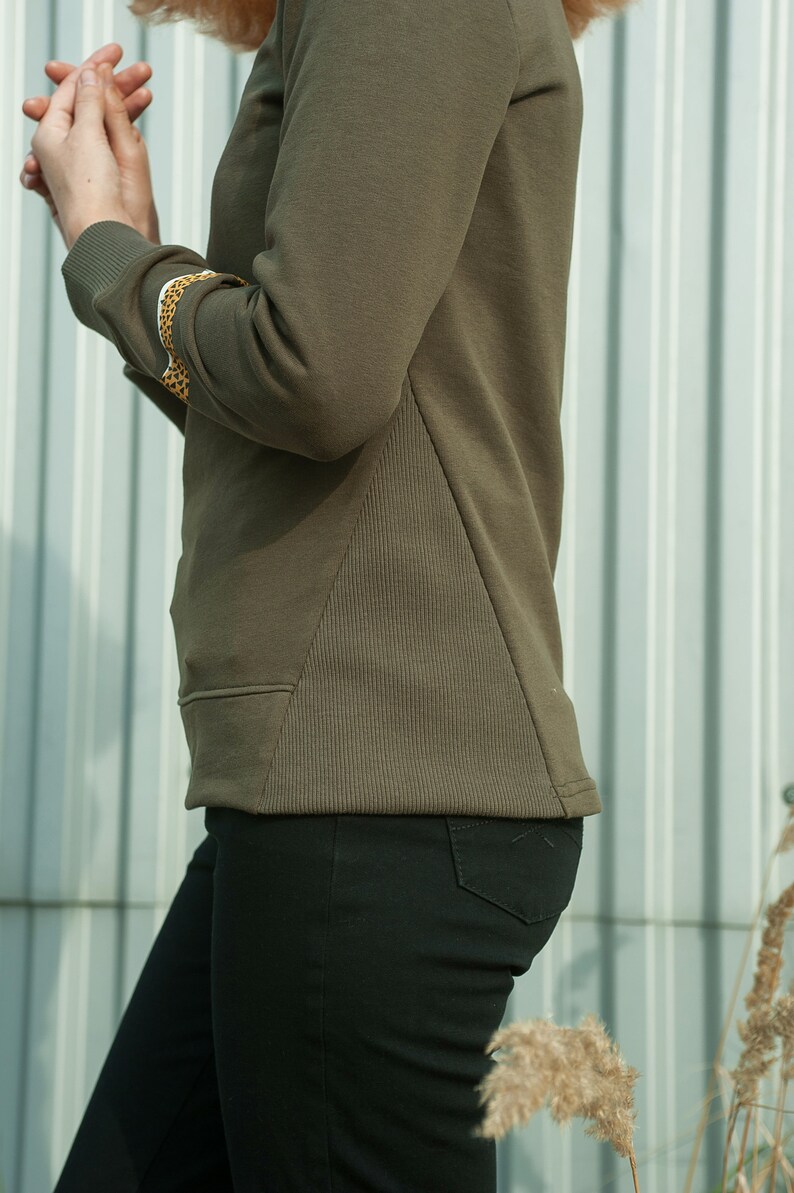 tatoo designed print Slow fashion khaki sweatshirt of v neck style with animal printed bracelet light sping apparel grunge sweater