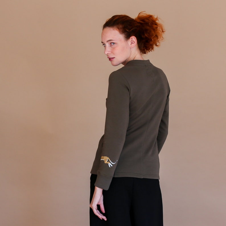tatoo designed print Slow fashion khaki sweatshirt of v neck style with animal printed bracelet light sping apparel grunge sweater
