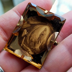 Vintage jewelry brooch, French religious brooch. Magnificent elegant jewelry, Collection in broze, transparent bakelite, Notre Dame.