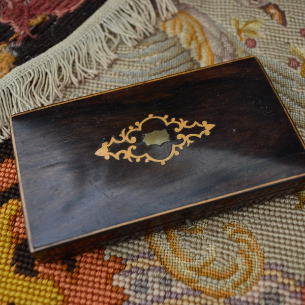 Old wooden jewelry box. Ancient storage of expensive business. Classic style. Remembrance.Heritage of ancient times.