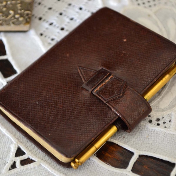 Old French leather diary, old original pencil. Vintage of the year 1930.Crayon in brass. Remembrance.Heritage of ancient times.