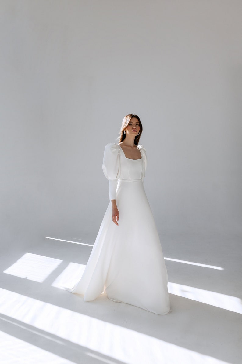 modest wedding dress crepe a line long sleeves puffy sleeves square neckline square back buttons back long train white bridal gown